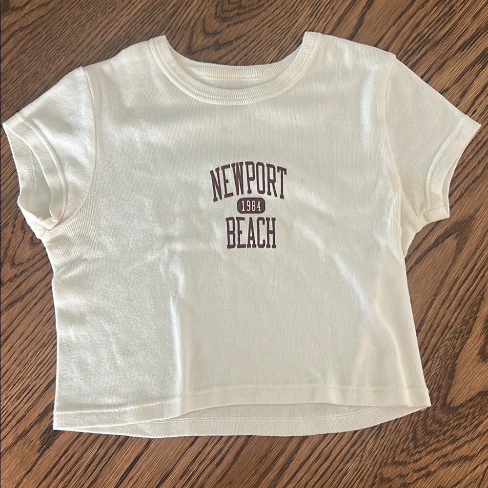Brandy Melville Cream Crop Top with Newport Graphic